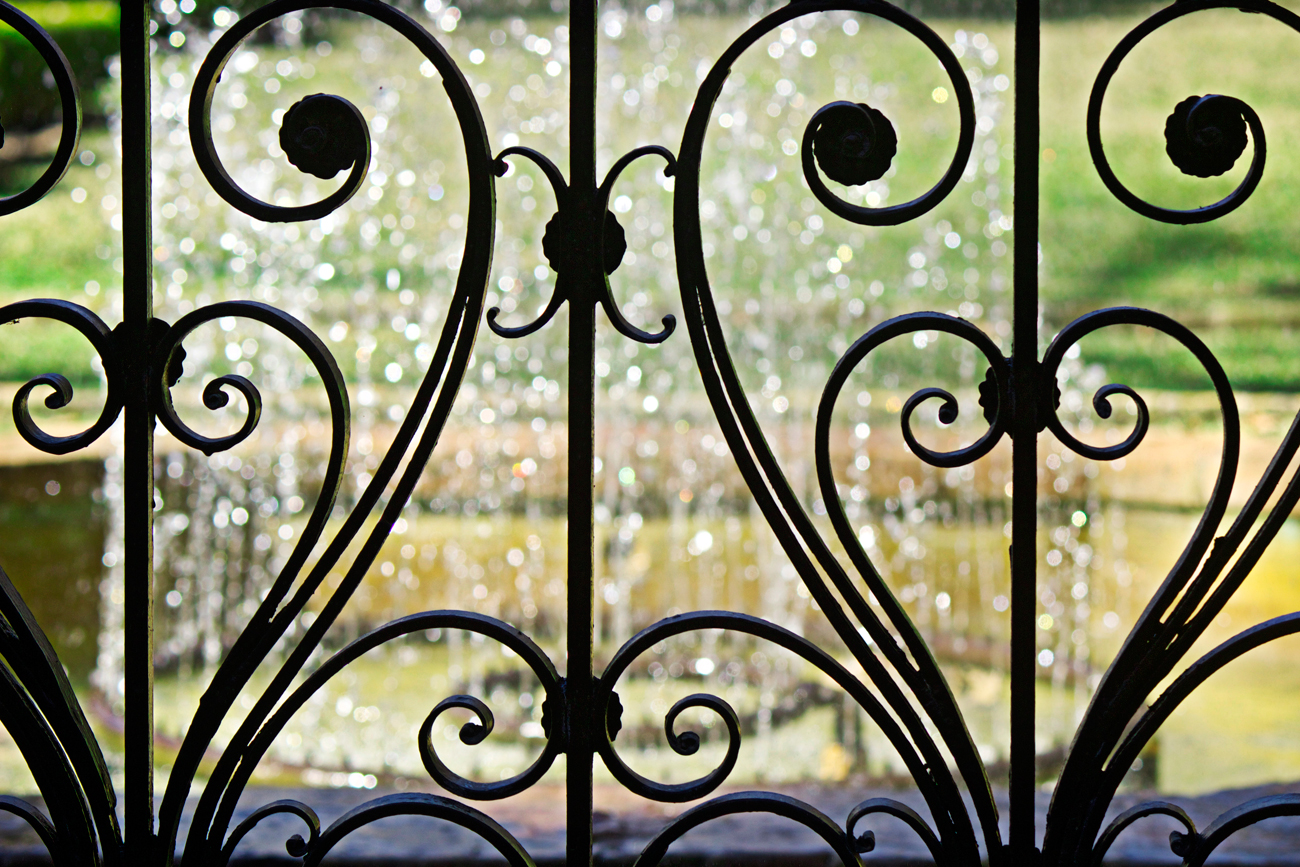 iron art nouveau gate with bokeh - photo copyright Allison Beth Cooling