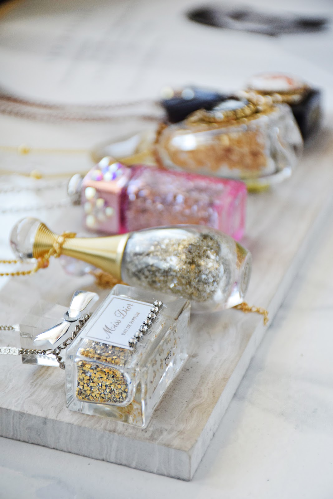 Recycled perfume bottle necklaces Necklaces by Allison beth Cooling